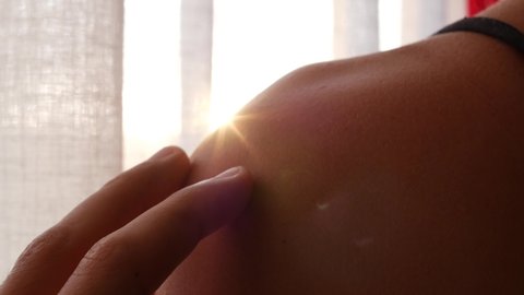 Man's hand gently touches the skin of a woman in front of the sunset, real time 4K