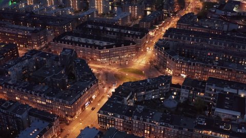Evening traffic in Amsterdam historical center, The Netherlands. Aerial drone footage of old beautiful European city