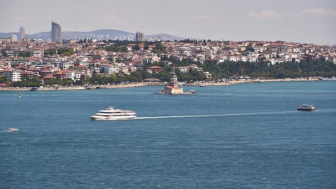 Aerial panorama time lapse of Bosphorus with Maiden Tower, and ships passing on a sunny day. Istanbul, Turkey