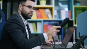 Businessman talking phone office for concept design. Modern communication technology. Man working on laptop. People lifestyle concept. People talking phone. Conversation concept. - Powered by Shutterstock - Get 15% off with code: PIKWIZARD15