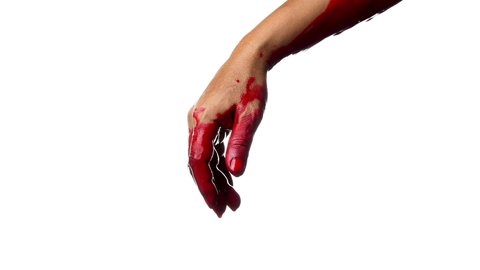 Closeup shot of  bloody hands with blood dripping on white background

