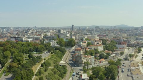 Aerial shot Belgrade Serbia. Beautiful flight on a drone through the streets of the city, where you can see the old and new city, streets, old buildings, transport on the streets, a beautiful urban la