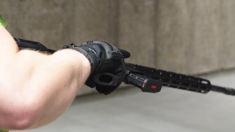 Reloading AR Style Rifle With Tactical Gloves in Shooting Range