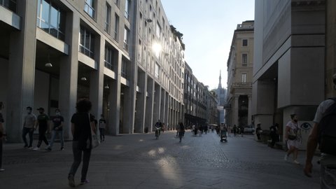Milan, Italy – September 16, 2020: Corso Vittorio Emmanuele during pre fashion week period. People wearing anti covid 19 masks.