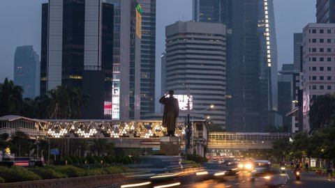 Jakarta, Indonesia - CIRCA 2020: Metropolitan Mega City Asia Skyline Buildings SkyScrapers Cityscape Traffic During Coronavirus Pandemic New Normal Time Lapse