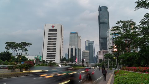 Jakarta, Indonesia - CIRCA 2020: Metropolitan Mega City Asia Skyline Buildings SkyScrapers Cityscape Traffic During Coronavirus Pandemic New Normal Time Lapse
