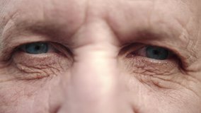 Face and eyes of mature person. Close up of large wrinkles on the face of senior male. Portrait of attractive elderly man. Doctor man face. - Powered by Shutterstock - Get 15% off with code: PIKWIZARD15