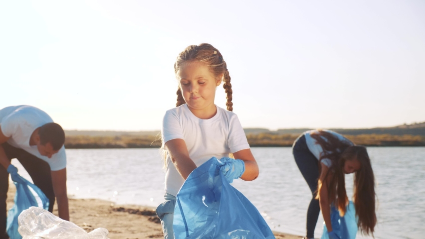 kid collecting trash volunteer a teamwork. child group happy family on collects garbage plastic trash waste bottles. ecology environmental happy family teamwork volunteer awareness trash pollution Royalty-Free Stock Footage #1059127457