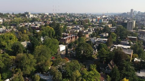 Aerial / drone footage of the upscale Capitol Hill neighborhood, Eastlake, Capitol Hill downtown Seattle with smoke in the air from the Washington State wildfires in Seattle, Washington