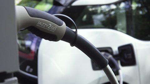 Berlin / Germany - 09 14 2020: Smooth Gimbal shot of Charging Cable with Plug for Electric Vehicles