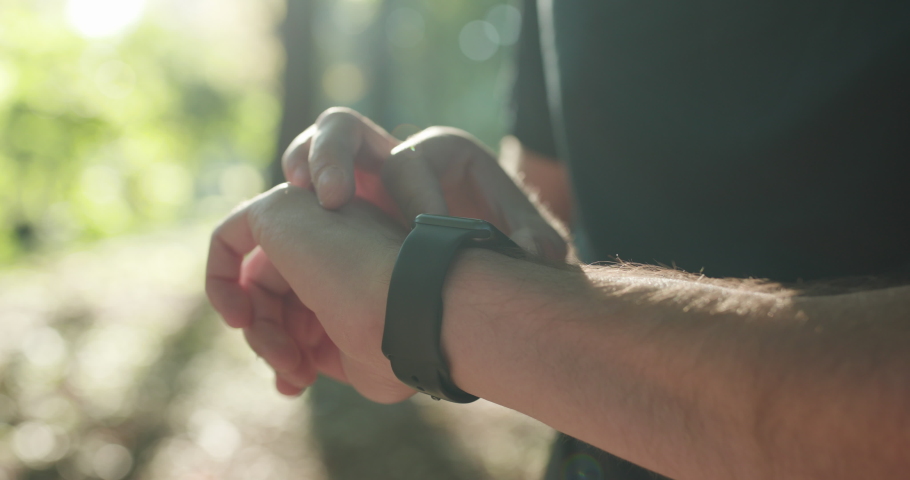Smart watch. Smart watch on a man's hand outdoor. Man's hand touching a smart watch | Shutterstock HD Video #1059143738