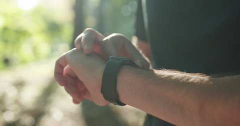 Smart watch. Smart watch on a man's hand outdoor. Man's hand touching a smart watch