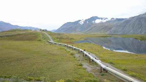 Crude Oil & Petroleum Pipeline in Alaska with Scenic Mountain Backdrop - Aerial Drone