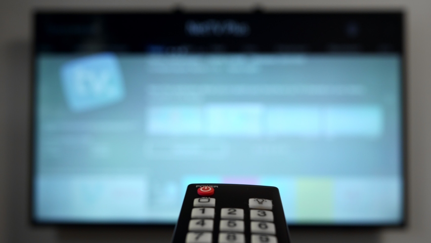 Remote control pointing on Smart TV. | Shutterstock HD Video #1059151082