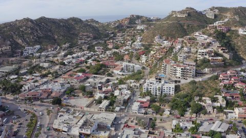 Daytime aerial panoramic view of the mountains of the Pedregal area of Cabo San Lucas, Baja California Sur, Mexico.