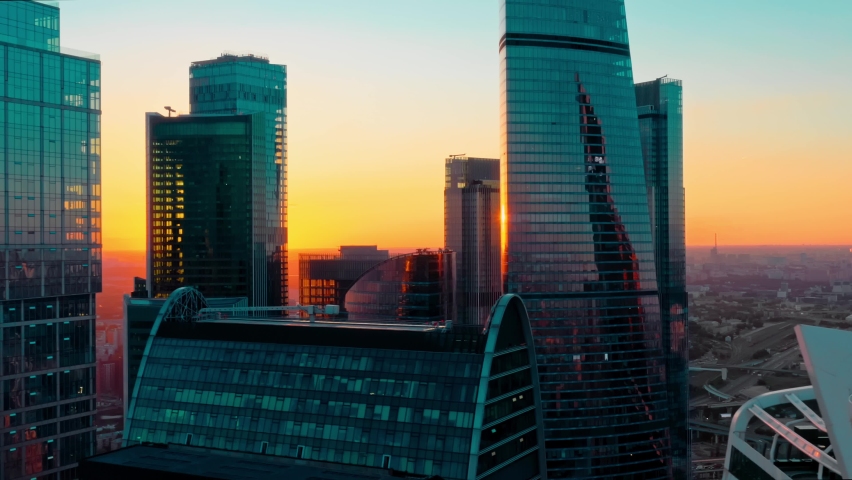Aerial shot of futuristic Moscow International Business Center at sunset. Moscow Downtown skyscrapers. The concept of success. the camera is going right..High quality 4k footage | Shutterstock HD Video #1059161135