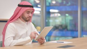 Professional Arab Businessman doing Video Call on Tablet in Office