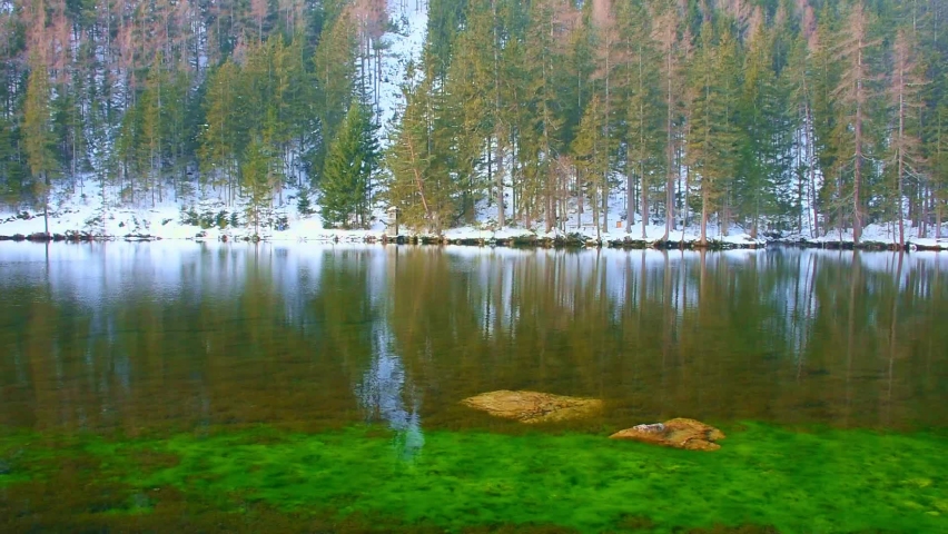 Green lake (Gruner see) in sunny winter day. Famous tourist destination for walking and trekking in Styria region, Austria
