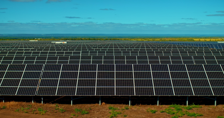 Solar panels stand in a row, state of the art solar energy conversion plants. Innovative technologies, solar cells. 4k, ProRes | Shutterstock HD Video #1059166001