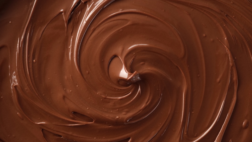 melted premium chocolate top view rotating. Confectionery concept Royalty-Free Stock Footage #1059187388