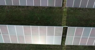 4K Aerial footage of photovoltaic solar farm. Solar farm power station from above. Ecological renewable energy.