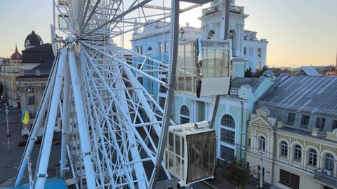Ferris wheel in the morning at sunrise in Kyiv, Ukraine. Aerial view