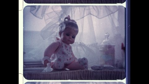 1970s USA Lazy Dazy Doll by Ideal Toy Company. Young Girl in Frock Scolds Baby Doll and Spanks her for Bad Behavior.  4K Overscan of Archival 16mm Film of Vintage Television Commercial