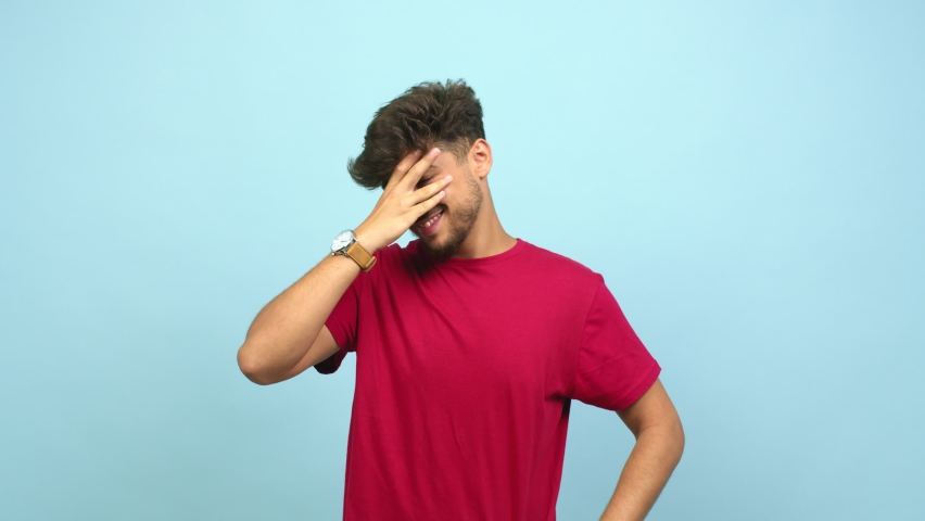 Young arab man embarrassed but laughing, is afraid to face something but is positive Royalty-Free Stock Footage #1059206516