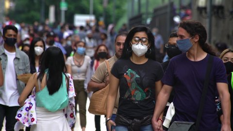 MEXICO CITY, SEPT 2020. A lot of people wearing face masks walk on the Madero street after authorities relaxed the restrictions about COVID 19, people try to return to their activities.