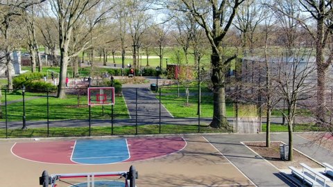 An empty basketball court with rims removed during Covid-19 at Marine Park in Brooklyn, New York.  Removing the rims ensures that no one will play in close proximity of each other.