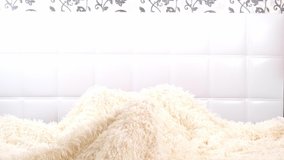 Attractive young woman gets up in bed with a cup of coffee and an alarm clock. The woman overslept and is late, reacting with horror at the time - Powered by Shutterstock - Get 15% off with code: PIKWIZARD15