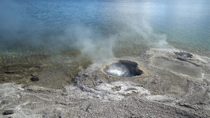 Yellowstone Hot springs boiling water and steaming vents.