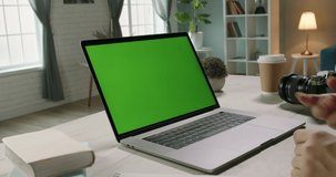 Close up shot of hands of remote worker gesturing near green screen laptop during video chat with employees or conference with customers - communnications concept 4k video template