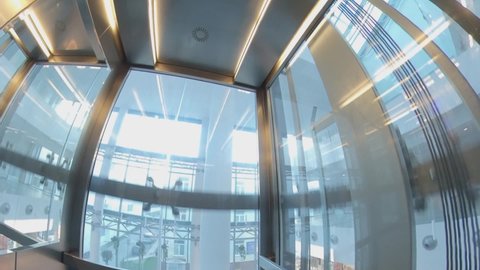 Wide Angle View of Elevator Interior with Glass Walls POV