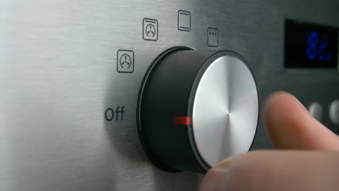 Setting Electric Oven Modes by Turning Switch Control Close Up
