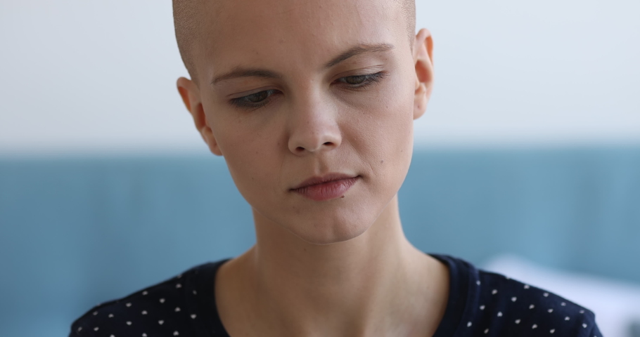 Cancer Survivors Day concept. Close up view face portrait of bald caucasian attractive woman looking at camera having charming wide smile, girl recovered from oncology disease feels happy pose indoors Royalty-Free Stock Footage #1059236033