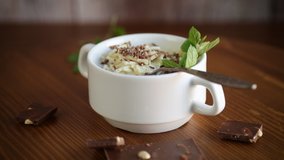 sweet noodles with milk and grated chocolate in a bowl