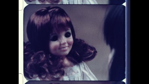 1970s USA Velvet & Crissy Doll by Ideal Toy Corporation. Young Girl Brushes Hair of Pull String Talking Doll.  4K Overscan of Archival 16mm Film of Vintage Television Commercial Advertisment