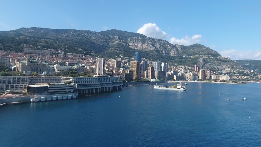 Establishing aerial view of Monaco Monte Carlo skyline and Monaco harbor French Riviera Cote d'Azur sea coastline on a beautiful sunny day during summer Royalty-Free Stock Footage #1059280610