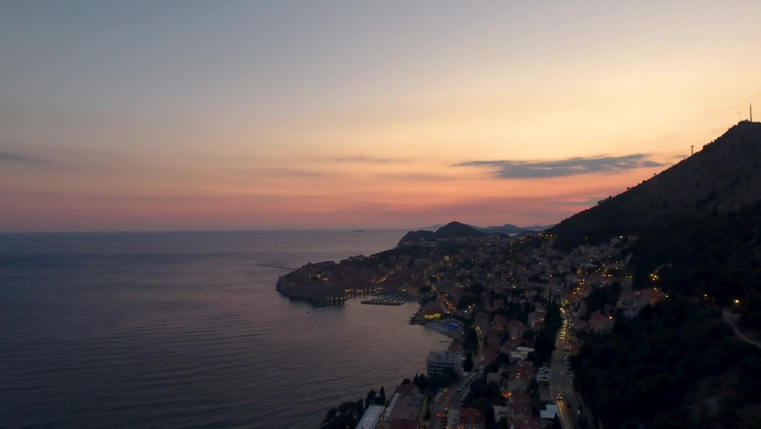 Aerial panoramic view over Dubrovnik Old-town and Adriatic sea coastline at sunset in Croatia Royalty-Free Stock Footage #1059280670