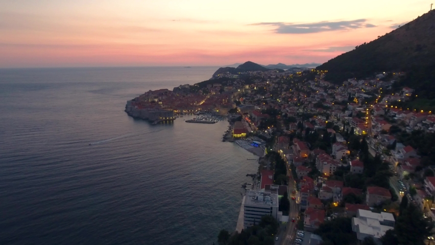 Aerial panoramic view over Dubrovnik Old-town and Adriatic sea coastline at sunset in Croatia Royalty-Free Stock Footage #1059280673