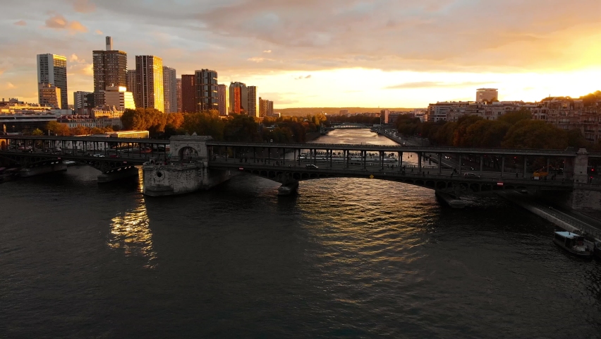 Aerial drone panoramic view of Melia Paris La Defense Skyline buildings office and Seine River, Paris buildings rooftops, France at sunset Royalty-Free Stock Footage #1059280805