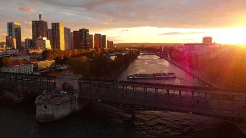 Aerial drone panoramic view of Melia Paris La Defense Skyline buildings office and Seine River, Paris buildings rooftops, France at sunset