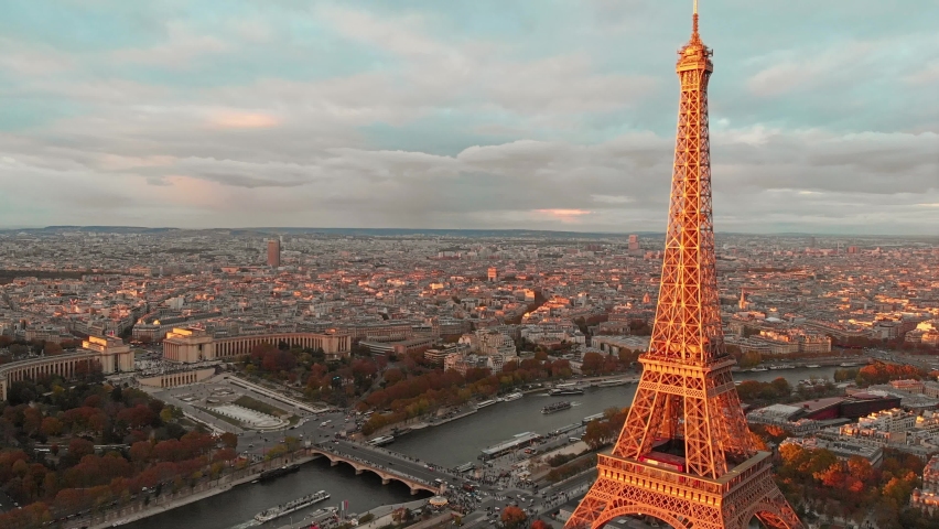 Aerial close up view of Paris Eiffel Tower Tour de Eiffel and panoramic view over Seine River and Paris city attractions at sunset Royalty-Free Stock Footage #1059280979