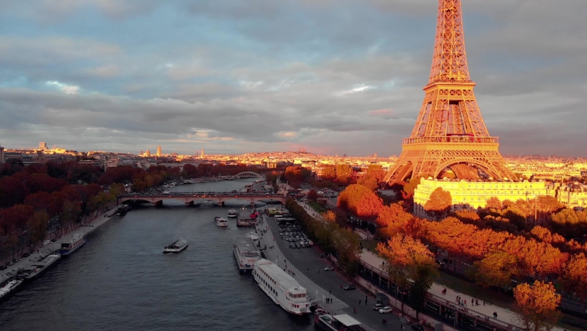 Aerial close up view of Paris Eiffel Tower Tour de Eiffel and panoramic view over Seine River and Paris city attractions at sunset Royalty-Free Stock Footage #1059280982