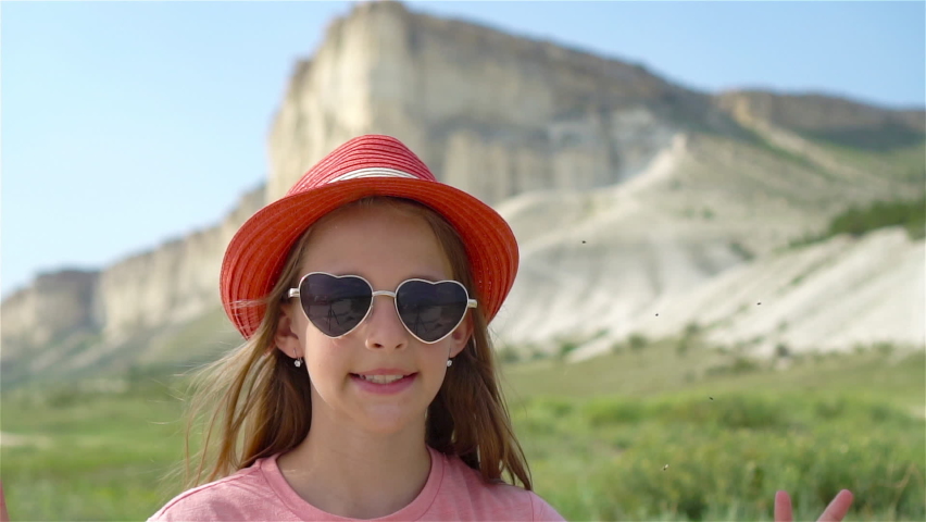 Little girl on summer vacation in mountains