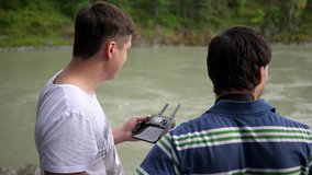 Two guys shoot a video using a drone