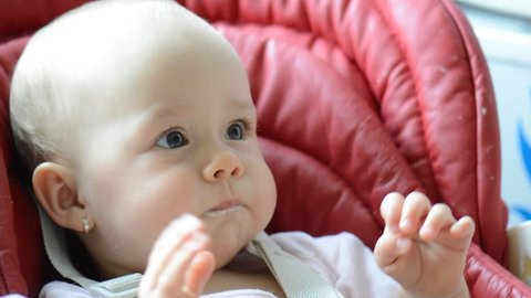 Infant girl eat baby puree