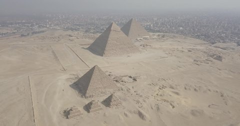 Aerial view of Pyramid of Menkaure then the pyramids of Khafre and Khufu, Giza pyramids landscape. historical egypt pyramids shot by drone.