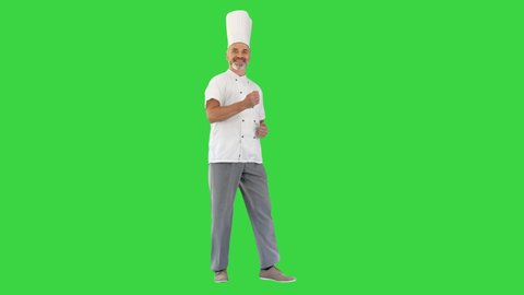 Funny male chef cook dancing on a Green Screen, Chroma Key.